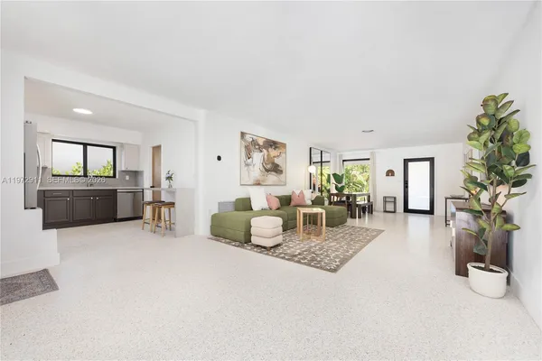 a living room with furniture and a table