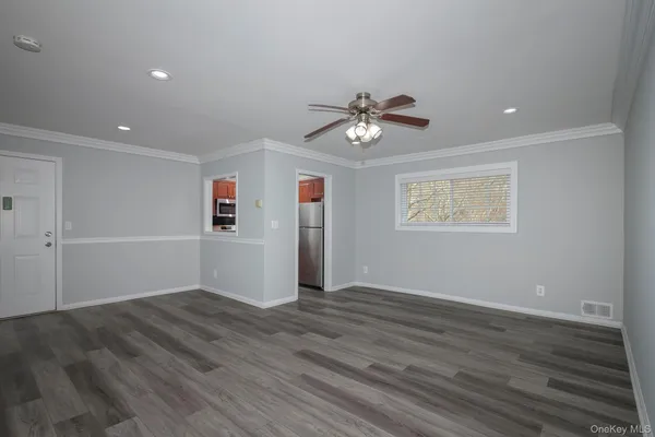 a view of an empty room with a window