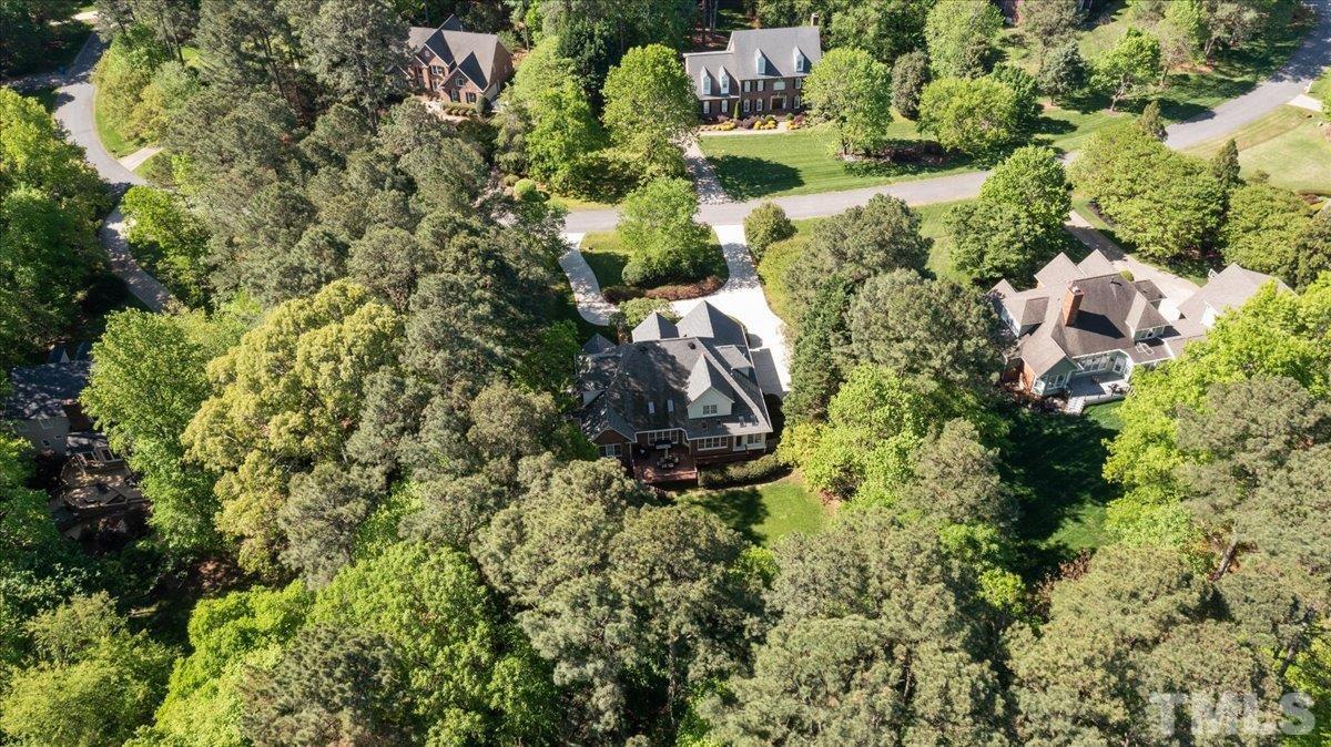 10136 Old Warden Road Raleigh, NC 27615 - Photo 3 of 42 an aerial view of residential house with outdoor space and trees all around