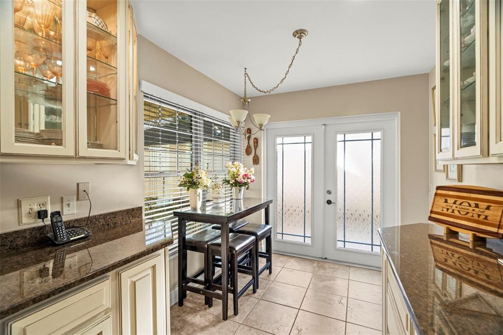 4730 Sheffield Drive New Port Richey, FL 34655 - Photo 12 of 53 a kitchen with granite countertop a sink and a refrigerator
