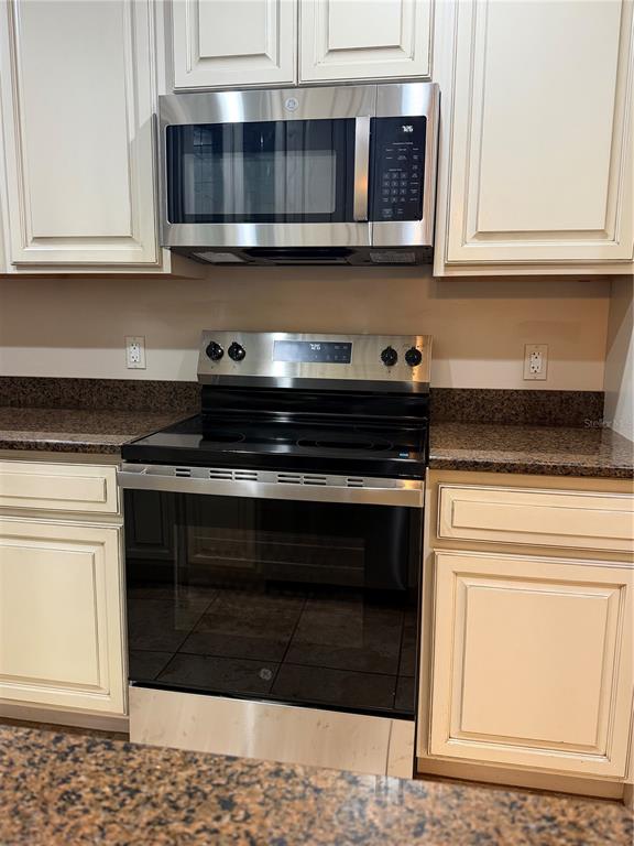 4730 Sheffield Drive New Port Richey, FL 34655 - Photo 15 of 53 a stove top oven sitting inside of a kitchen