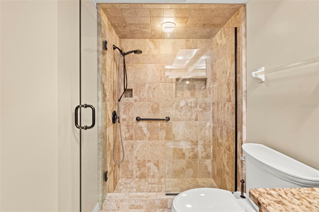 4730 Sheffield Drive New Port Richey, FL 34655 - Photo 24 of 53 a bathroom with a shower and toilet