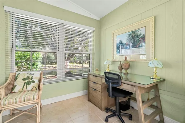 a view of backyard of house with green space