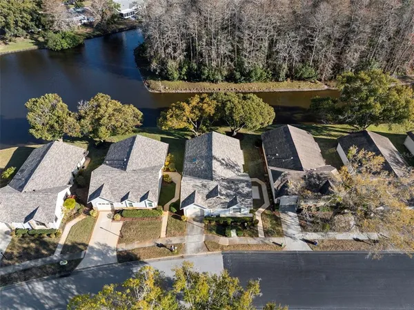 an aerial view of residential houses with outdoor space