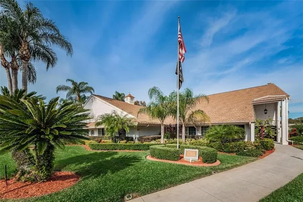 an aerial view of house with yard swimming pool and outdoor seating