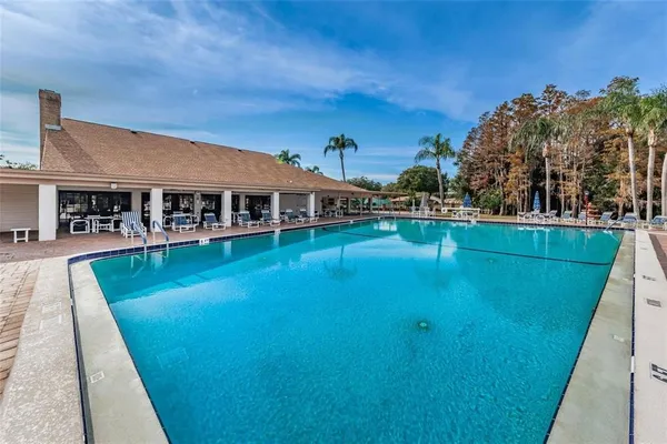 a living room with lots of furniture and wooden floor