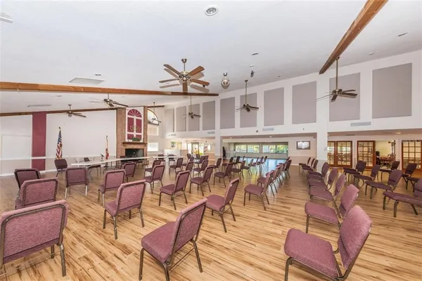 a living room with furniture and a book shelf