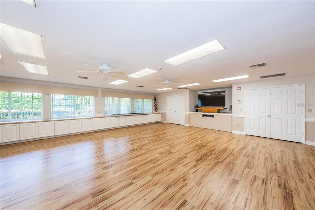 4730 Sheffield Drive New Port Richey, FL 34655 - Photo 43 of 53 a view of an empty room with wooden floor and a window