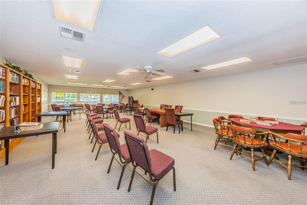 4730 Sheffield Drive New Port Richey, FL 34655 - Photo 46 of 53 a group of people sitting at tables in a room