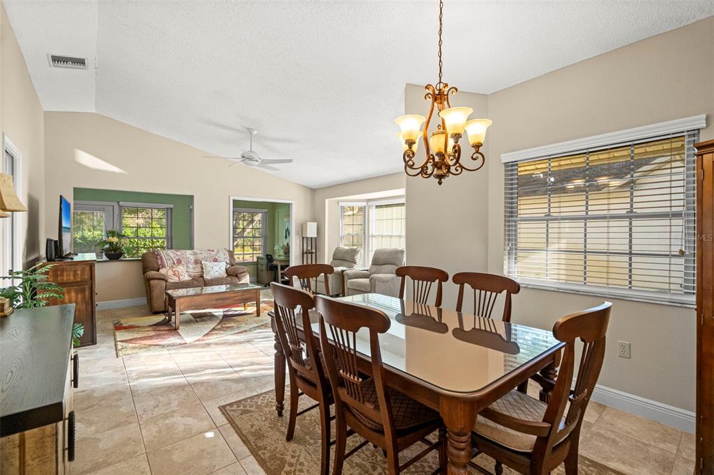 4730 Sheffield Drive New Port Richey, FL 34655 - Photo 9 of 53 a view of a dining room with furniture window and outside view