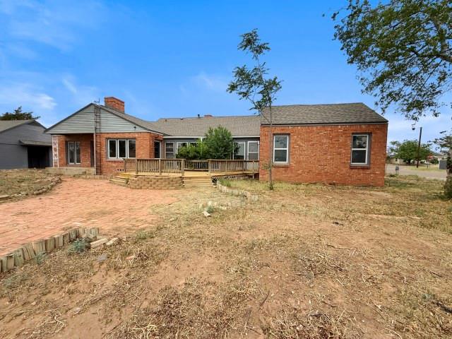 1001 North 3rd Street Lamesa, TX 79331 - Photo 3 of 32 a front view of a house with a yard
