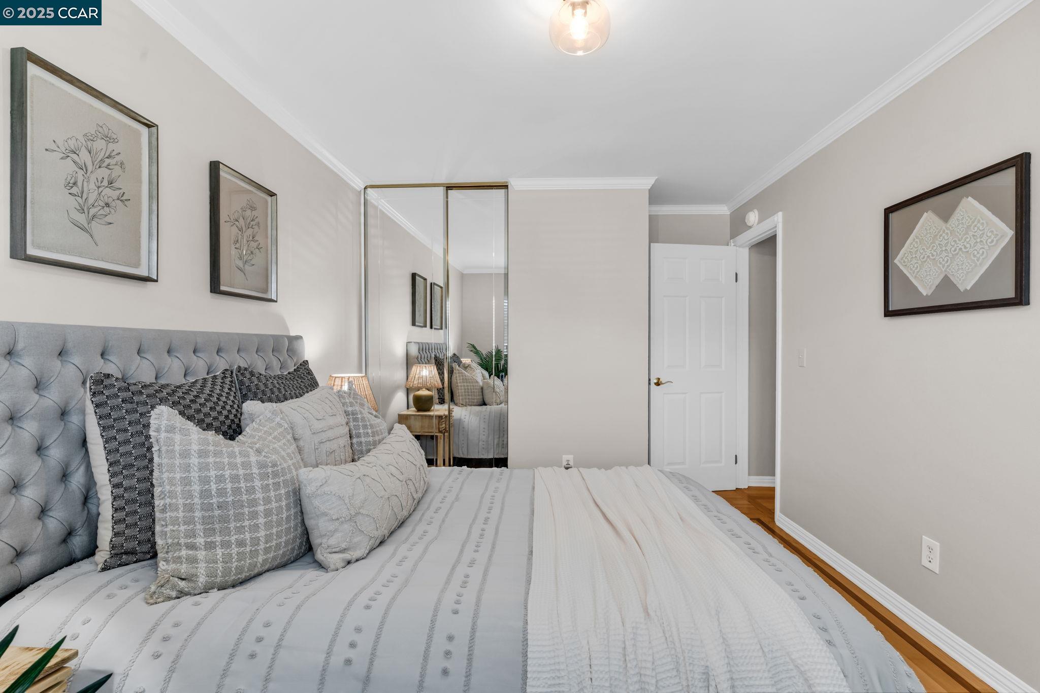 4380 St Charles Place Concord, CA 94521 - Photo 33 of 54 a spacious bedroom with a bed and a couch