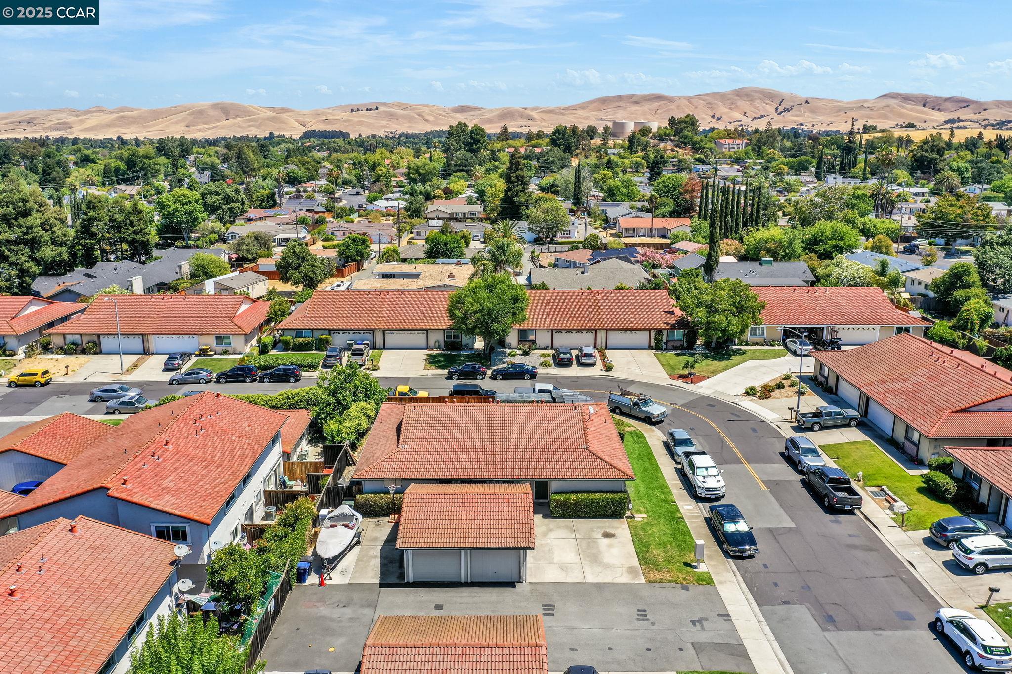 4380 St Charles Place Concord, CA 94521 - Photo 47 of 54 an aerial view of a city with lots of residential buildings and mountain view in back