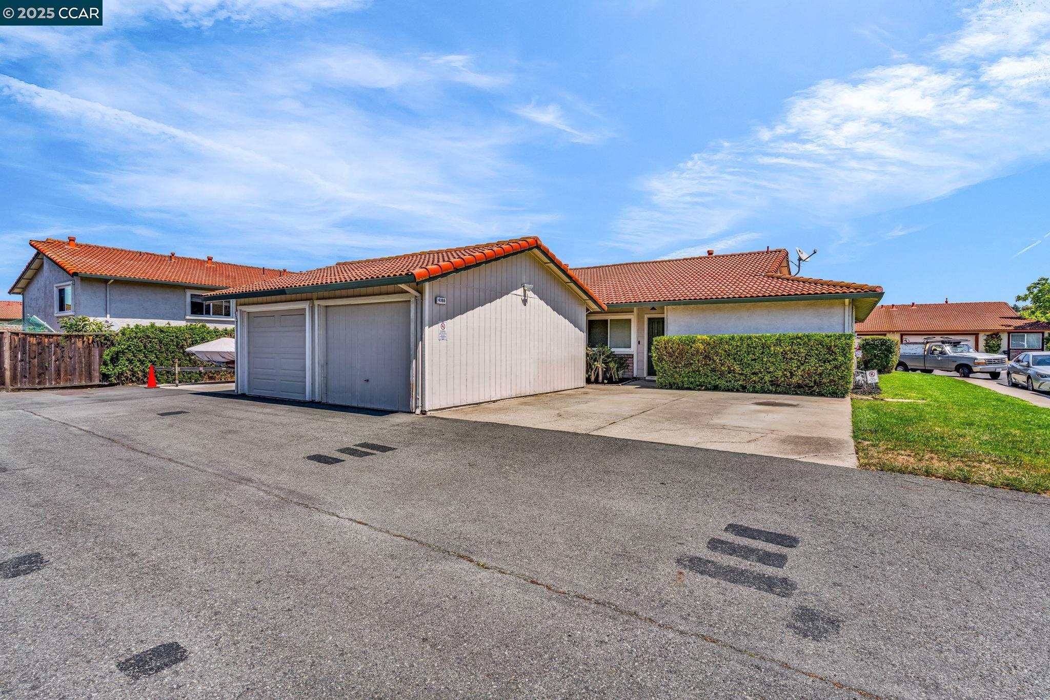 4380 St Charles Place Concord, CA 94521 - Photo 49 of 54 a view of a house with a yard and garage