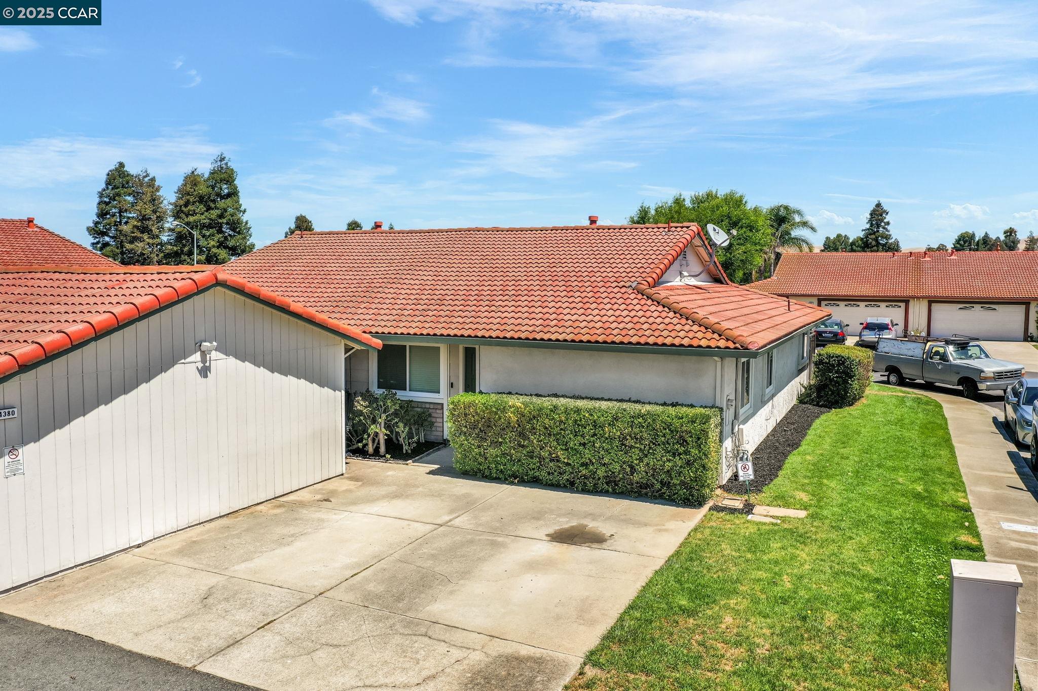 4380 St Charles Place Concord, CA 94521 - Photo 52 of 54 a front view of a house with a yard