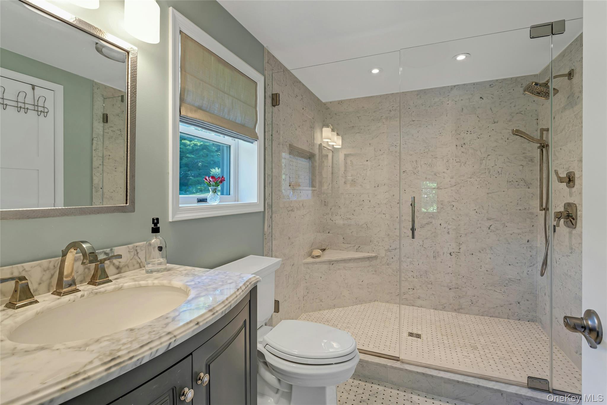 340 Osceola Road Jefferson Valley, NY 10535 - Photo 22 of 48 a bathroom with a granite countertop sink a toilet and shower
