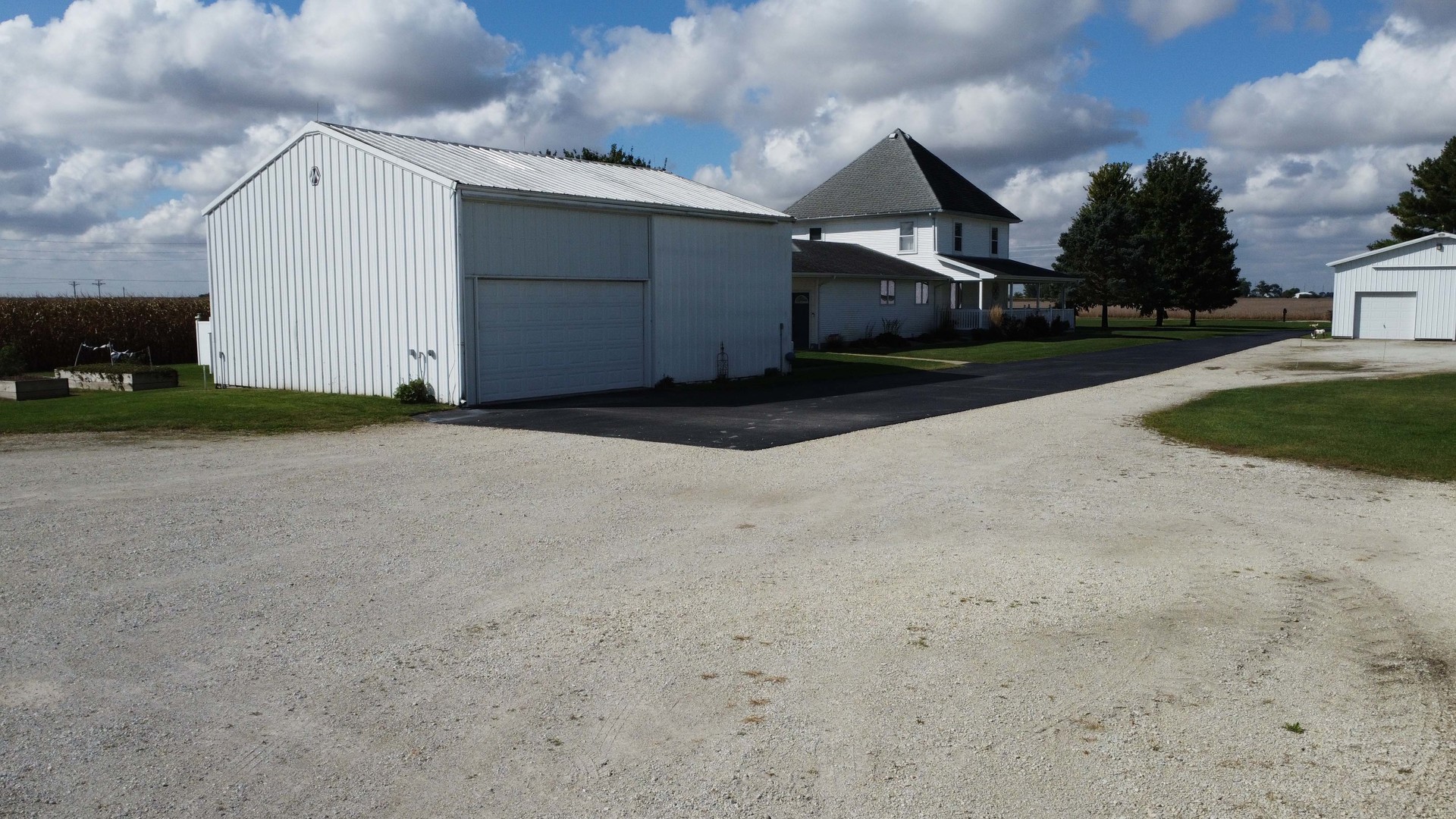 1718 North 1800 East Road Watseka, IL 60970 - Photo 15 of 113 a front view of a house with a yard and garage