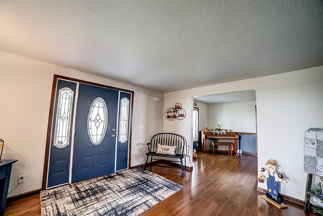 a view of a livingroom with furniture window and wooden floor