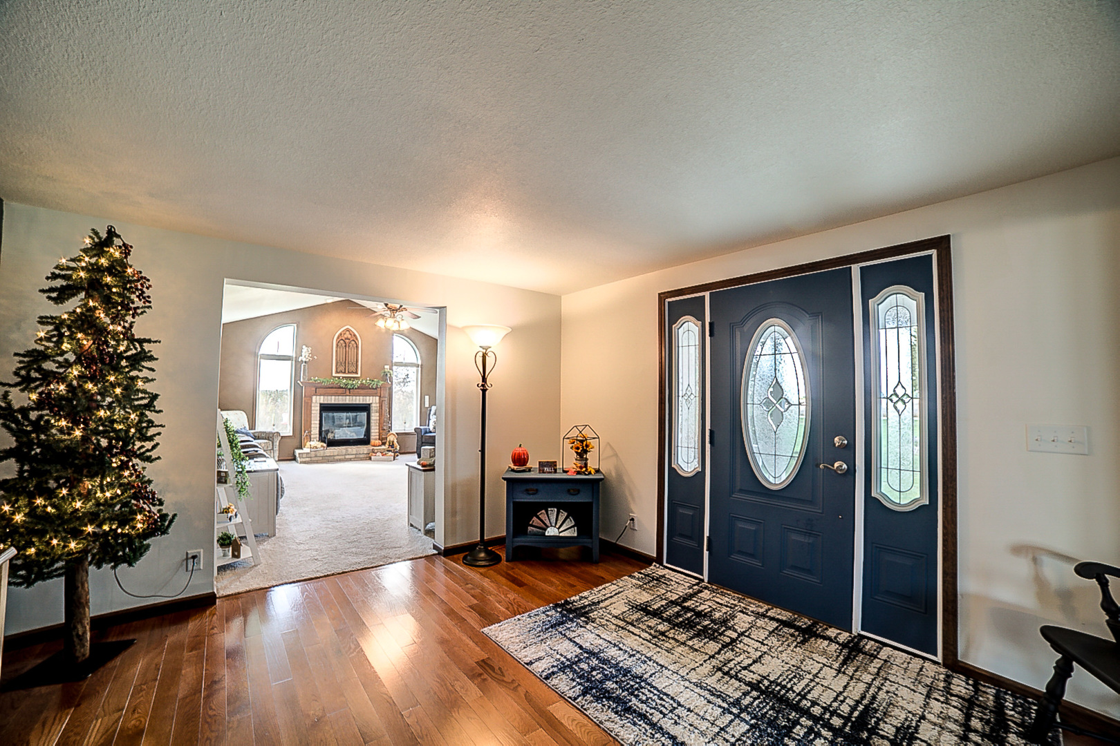 1718 North 1800 East Road Watseka, IL 60970 - Photo 22 of 113 a view of a livingroom with furniture and entryway wooden floor