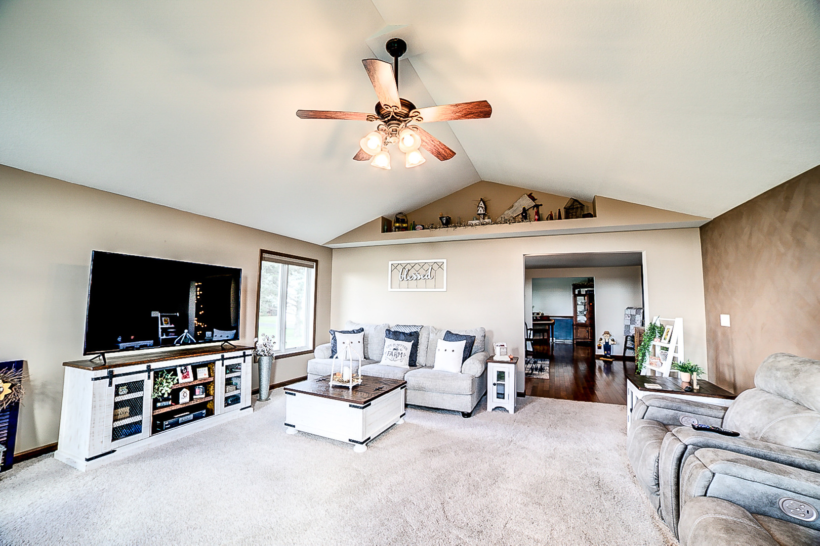 1718 North 1800 East Road Watseka, IL 60970 - Photo 24 of 113 a living room with furniture and a flat screen tv
