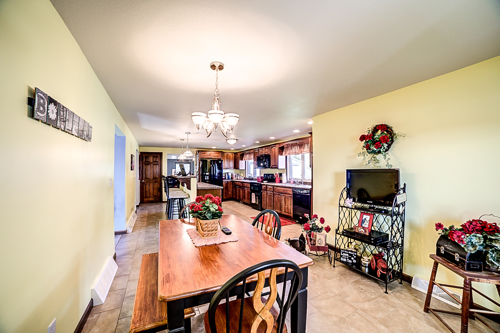 1718 North 1800 East Road Watseka, IL 60970 - Photo 42 of 113 a view of a dining room with furniture and a chandelier