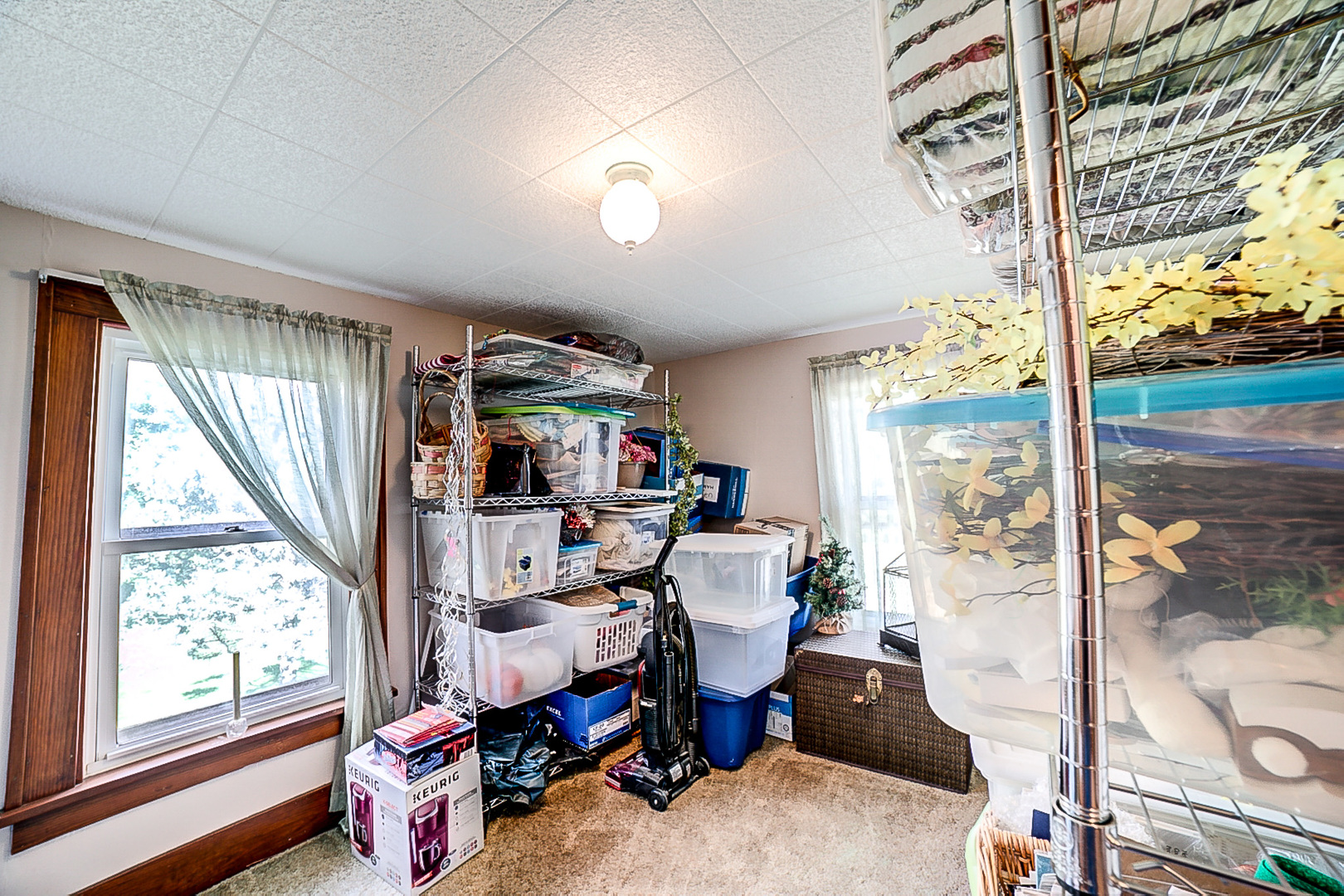 1718 North 1800 East Road Watseka, IL 60970 - Photo 69 of 113 a living room with furniture a flat screen tv and a floor to ceiling window