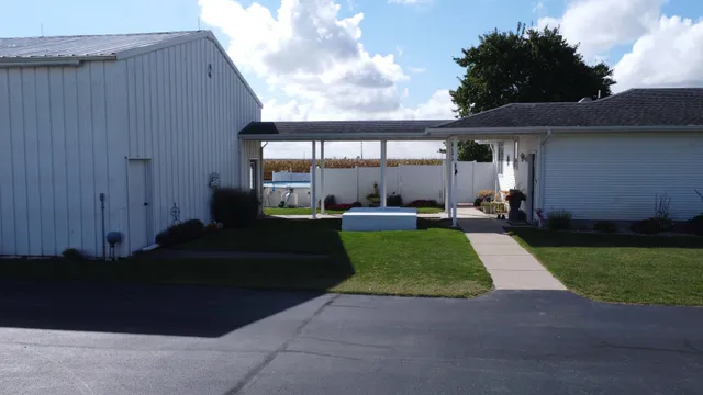 an aerial view of a house with a yard
