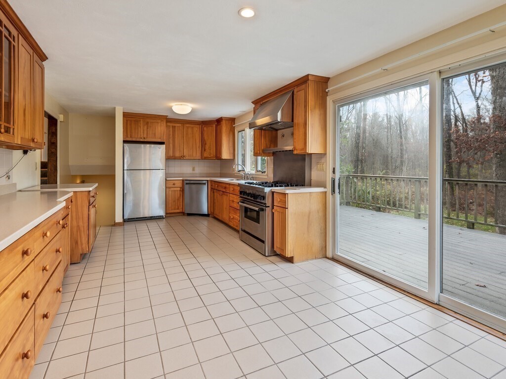 21 Hutchinson Road Sutton, MA 01590 - Photo 11 of 41 a kitchen with stainless steel appliances a sink and counter space