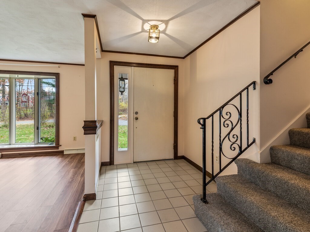 21 Hutchinson Road Sutton, MA 01590 - Photo 4 of 41 a view of a hallway with stairs