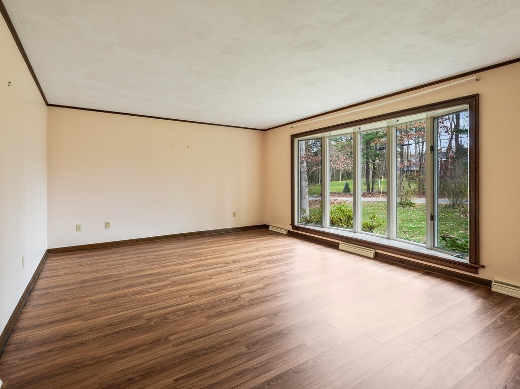 21 Hutchinson Road Sutton, MA 01590 - Photo 5 of 41 a view of a room with wooden floor and large window