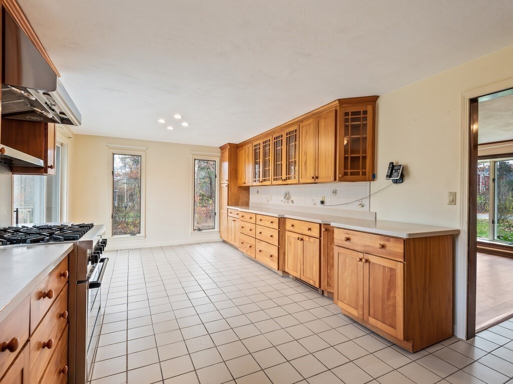 21 Hutchinson Road Sutton, MA 01590 - Photo 10 of 41 a large kitchen with stainless steel appliances granite countertop a sink and cabinets