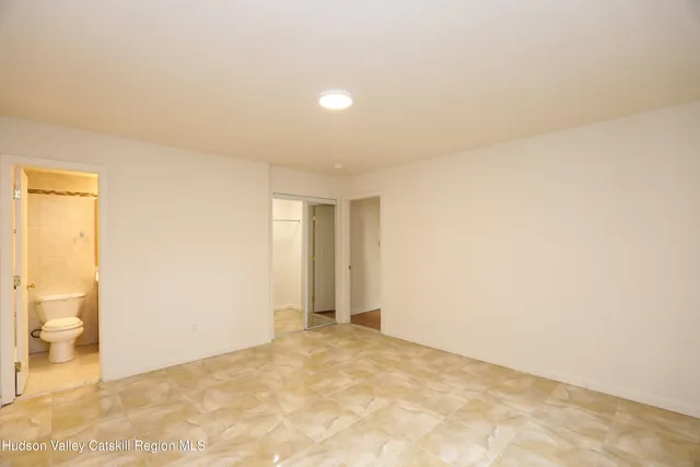 an empty room with a bathroom