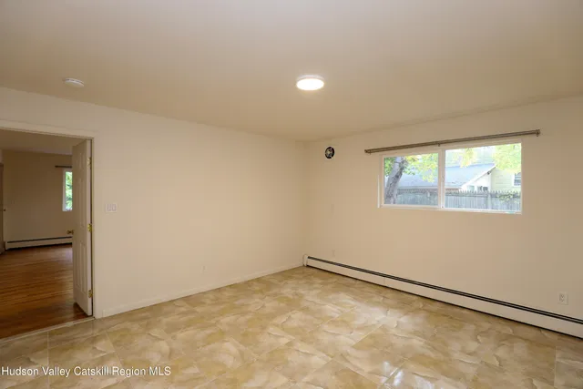 an empty room with a empty space and window