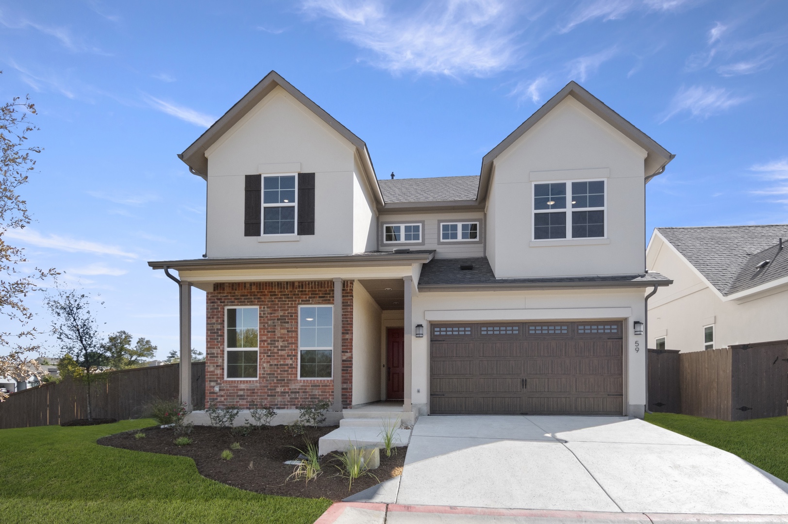 601 C-Bar Ranch Trail, Unit 59 Cedar Park, TX 78613 - Photo 1 of 34 View of front facade featuring brick siding, an attached garage, concrete driveway, a porch, and roof with shingles