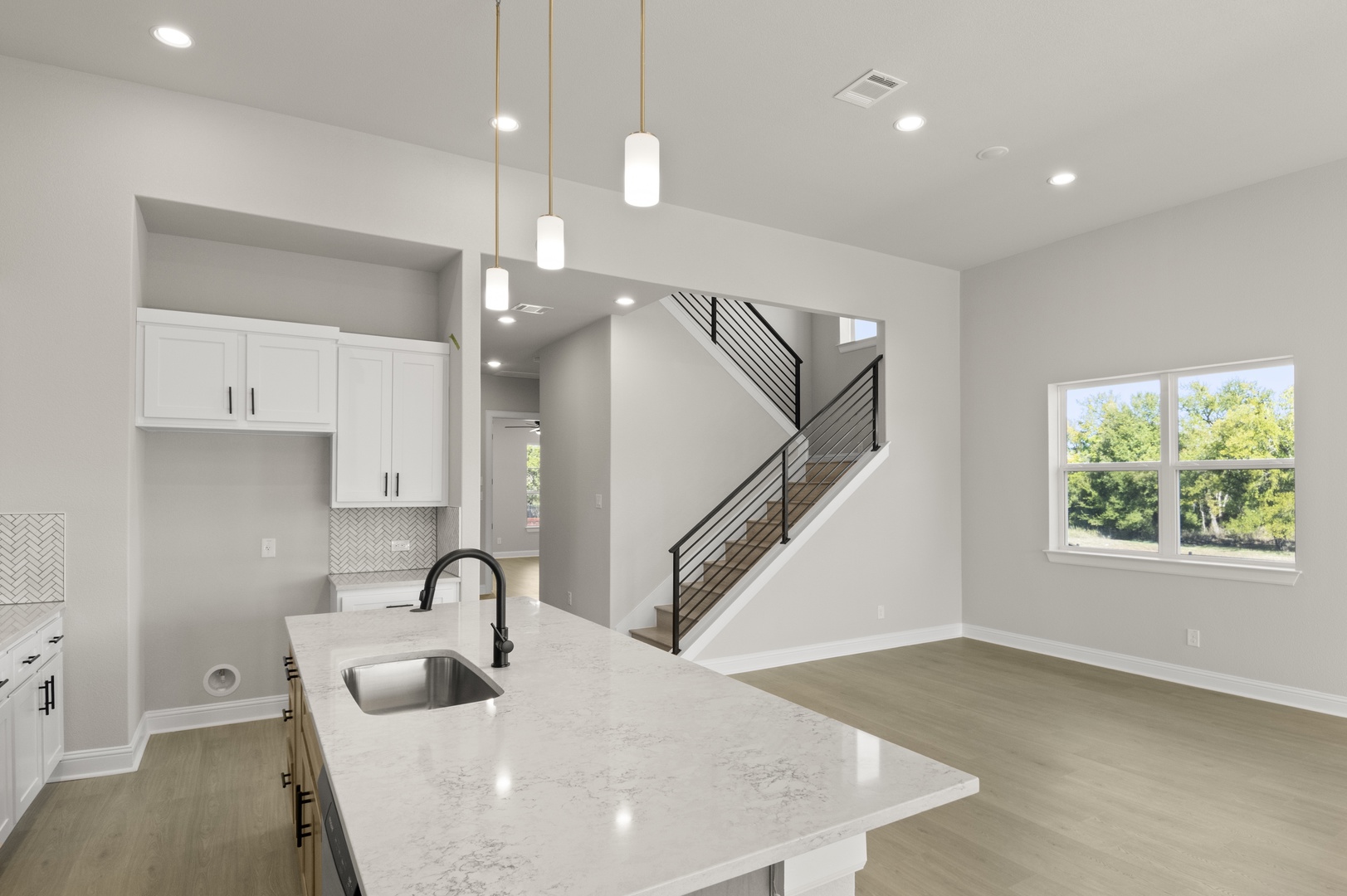 601 C-Bar Ranch Trail, Unit 59 Cedar Park, TX 78613 - Photo 18 of 34 Kitchen featuring recessed lighting, hanging light fixtures, light wood-type flooring, white cabinetry, and light stone countertops