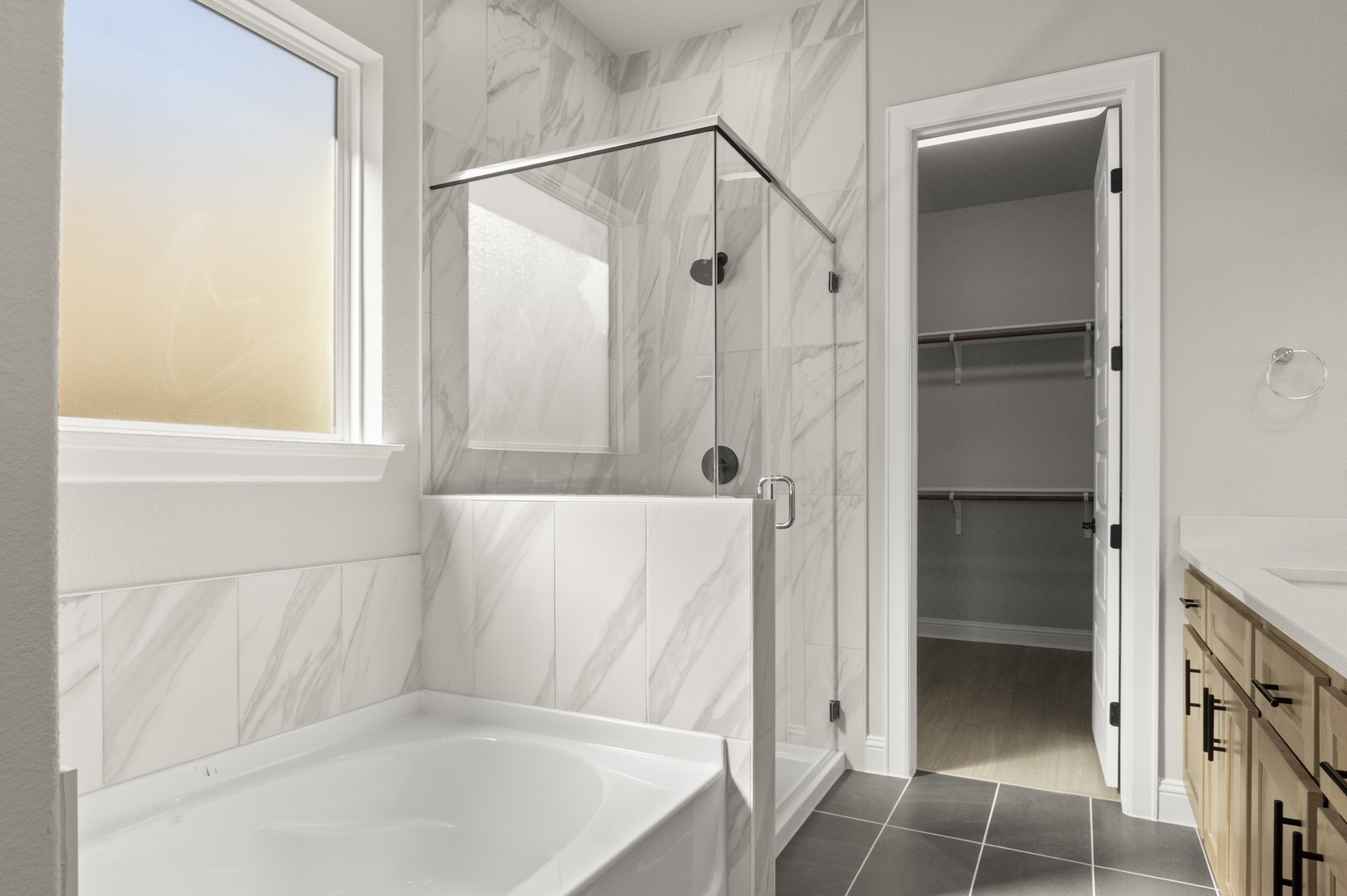 601 C-Bar Ranch Trail, Unit 59 Cedar Park, TX 78613 - Photo 23 of 34 Full bath with vanity, a bath, a marble finish shower, dark tile patterned floors, and a walk in closet