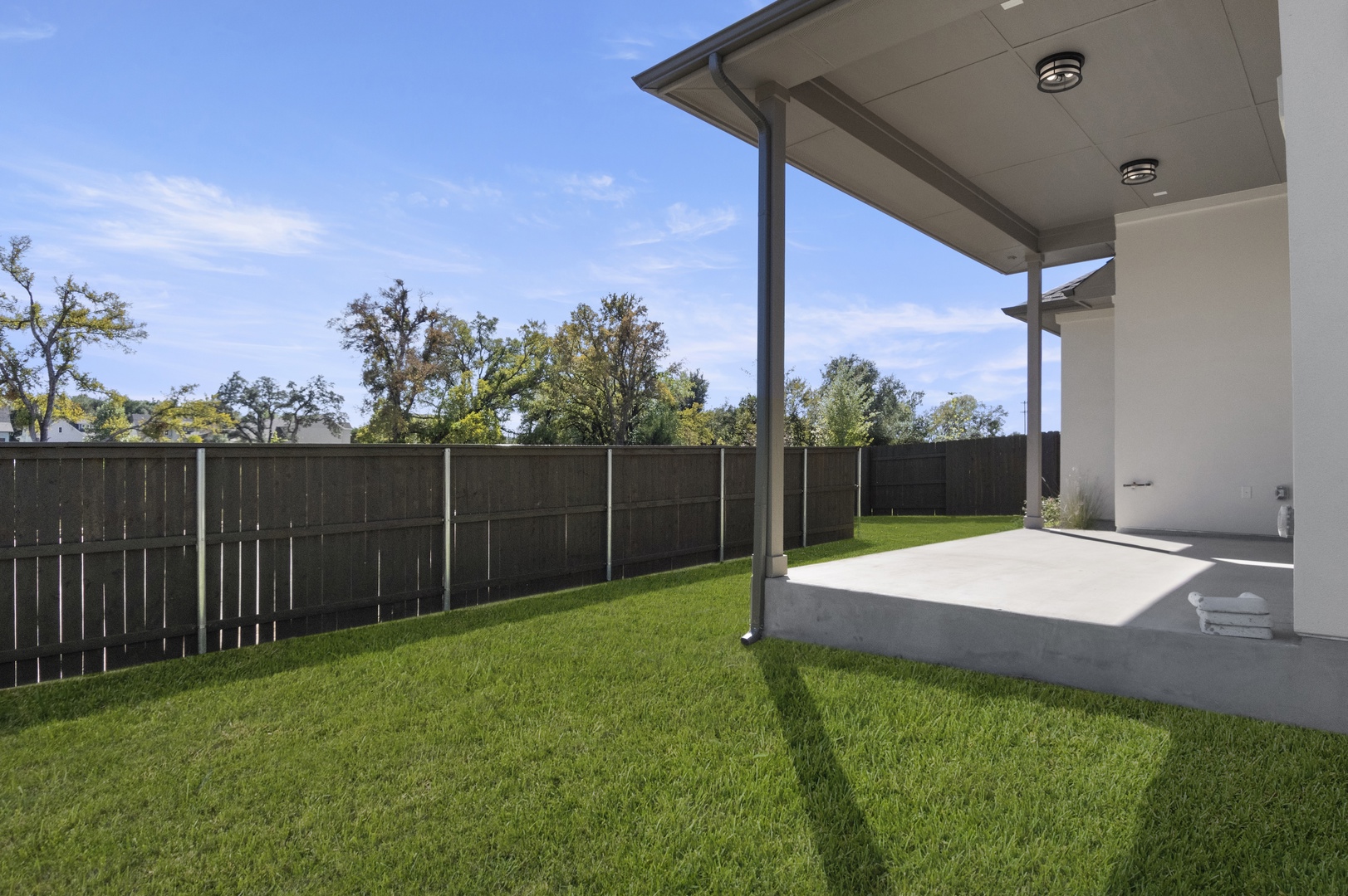601 C-Bar Ranch Trail, Unit 59 Cedar Park, TX 78613 - Photo 33 of 34 Fenced backyard with a patio area