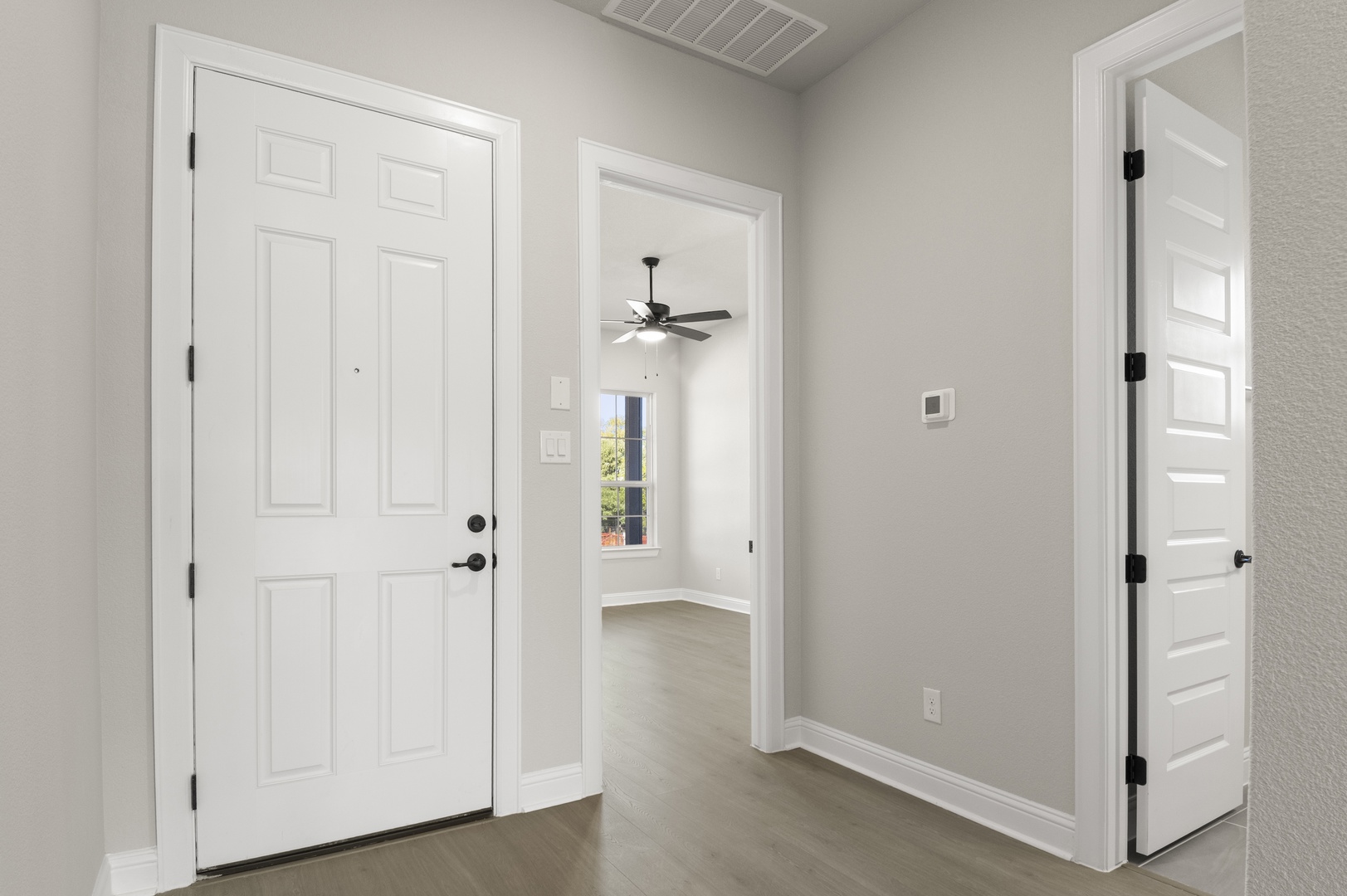 601 C-Bar Ranch Trail, Unit 59 Cedar Park, TX 78613 - Photo 5 of 34 Entrance foyer featuring wood finished floors and ceiling fan