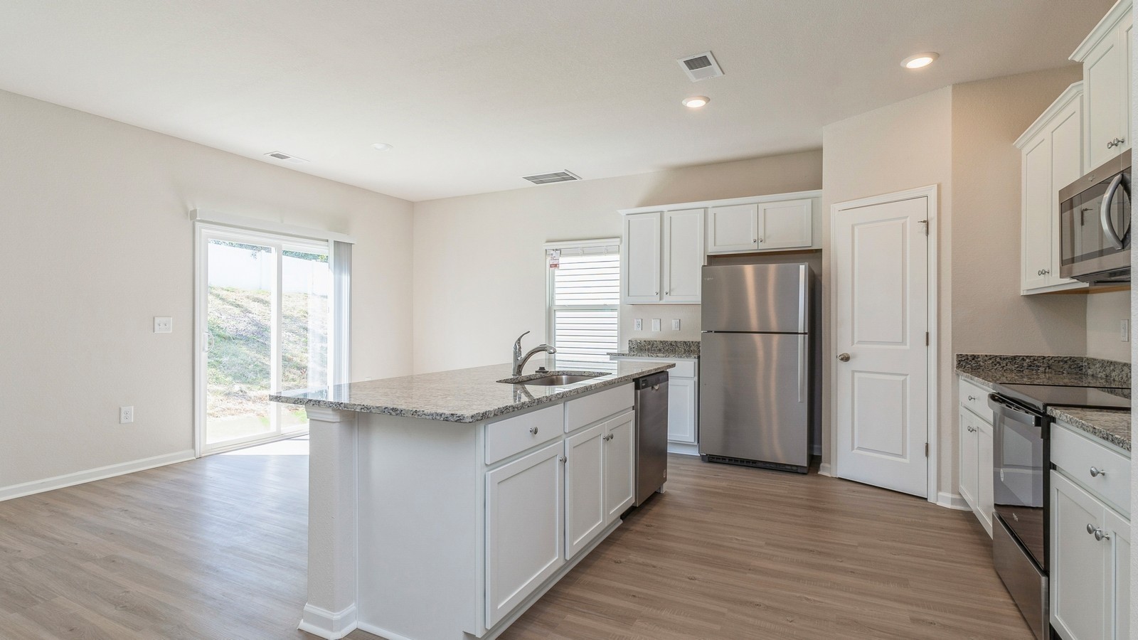 2309 Nabali Way Murfreesboro, TN 37127 - Photo 12 of 38 a kitchen with a sink a refrigerator and wooden floor