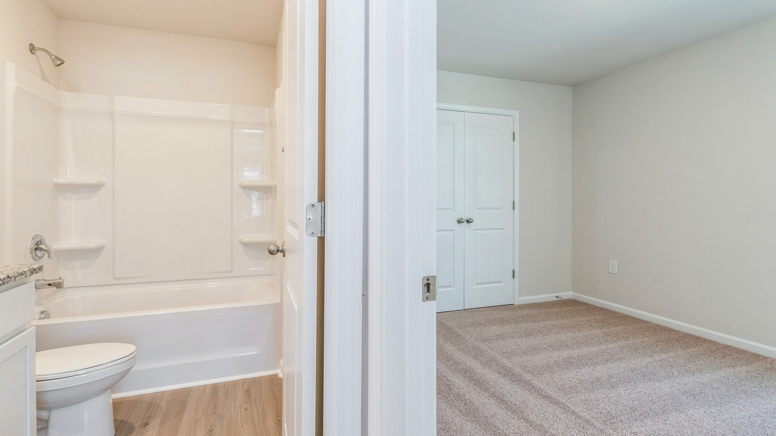 2309 Nabali Way Murfreesboro, TN 37127 - Photo 22 of 38 a bathroom with a granite countertop sink a toilet and shower