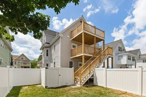 a view of a house with a small yard