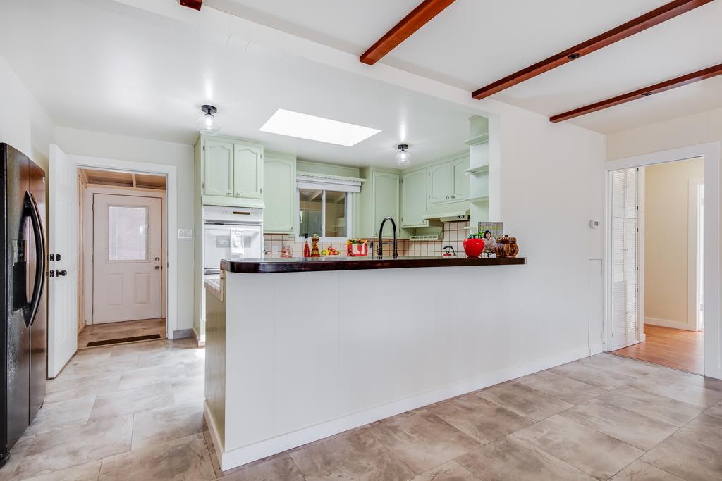 22930 Summit Road Los Gatos, CA 95033 - Photo 19 of 50 a view of kitchen with kitchen island a sink and a refrigerator