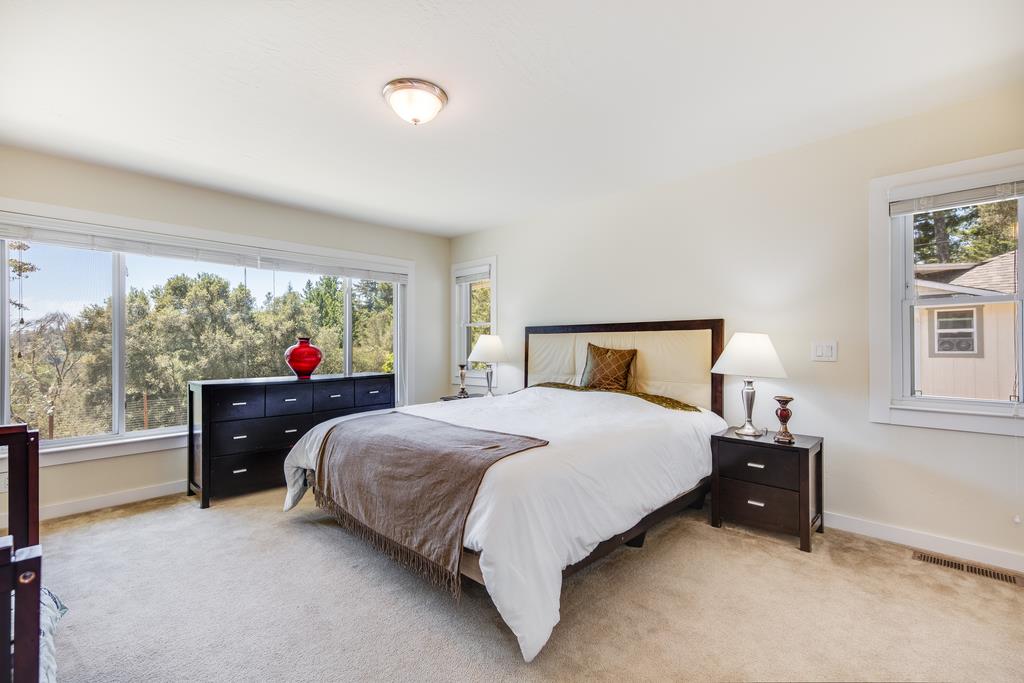 22930 Summit Road Los Gatos, CA 95033 - Photo 22 of 50 a bedroom with a bed and a large window