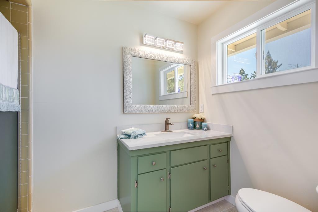 22930 Summit Road Los Gatos, CA 95033 - Photo 23 of 50 a bathroom with a toilet sink and mirror