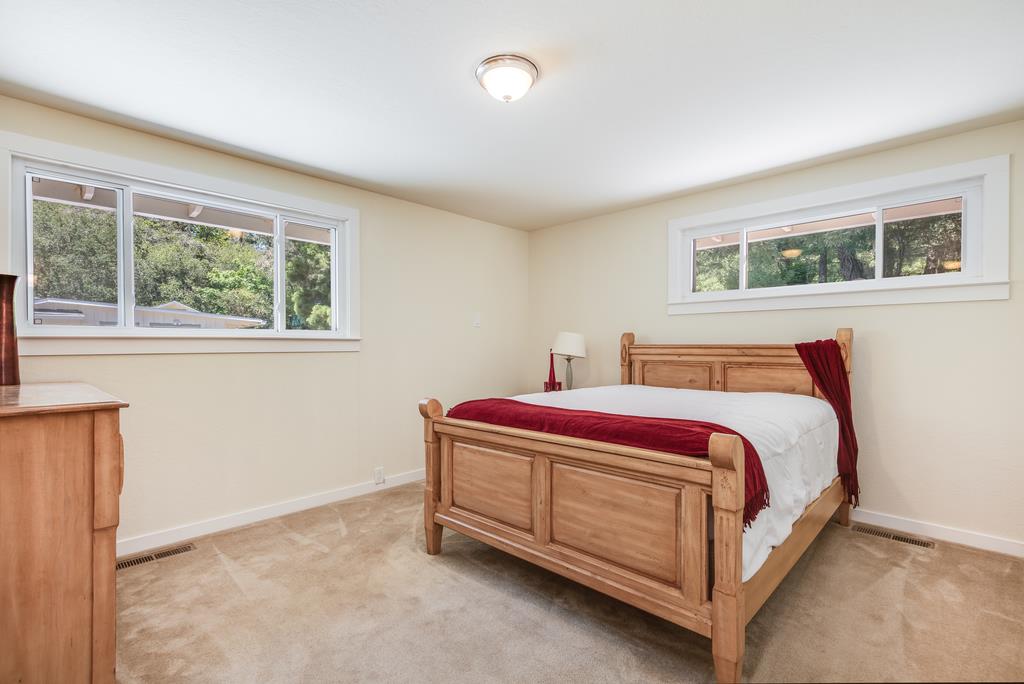 22930 Summit Road Los Gatos, CA 95033 - Photo 24 of 50 a spacious bedroom with a bed and window