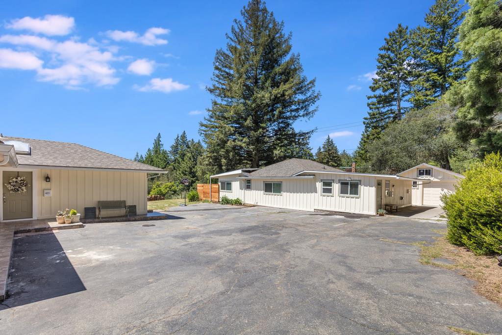 22930 Summit Road Los Gatos, CA 95033 - Photo 37 of 50 a white house that has a tree in front of it