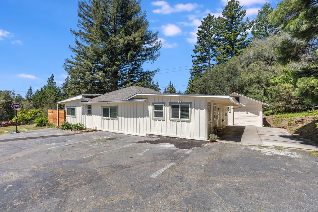 22930 Summit Road Los Gatos, CA 95033 - Photo 38 of 50 a front view of a house with a garden