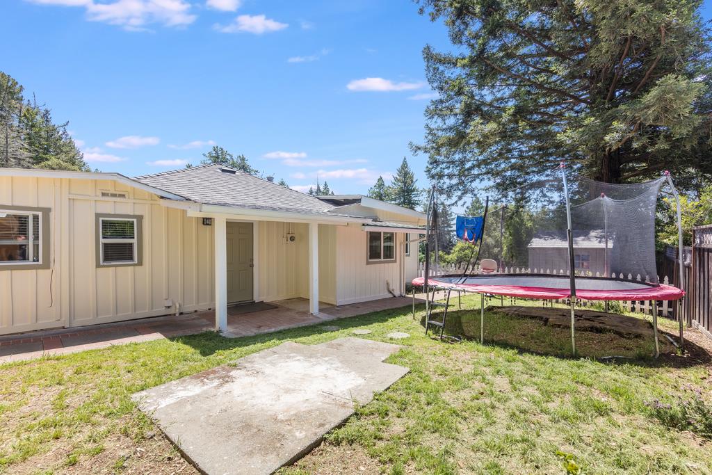 22930 Summit Road Los Gatos, CA 95033 - Photo 45 of 50 a front view of a house with a yard table and chairs