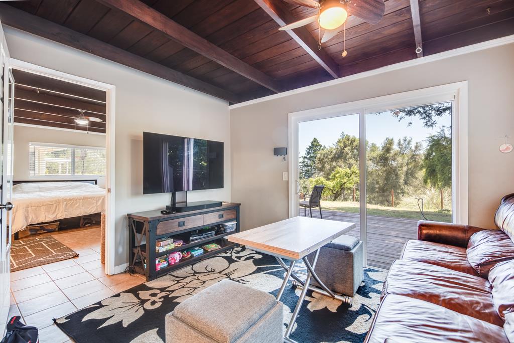 22930 Summit Road Los Gatos, CA 95033 - Photo 47 of 50 a living room with furniture and a flat screen tv