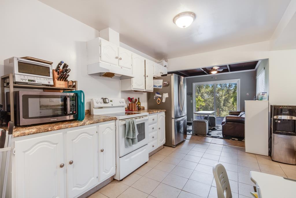22930 Summit Road Los Gatos, CA 95033 - Photo 48 of 50 a kitchen with stainless steel appliances a stove refrigerator sink and microwave
